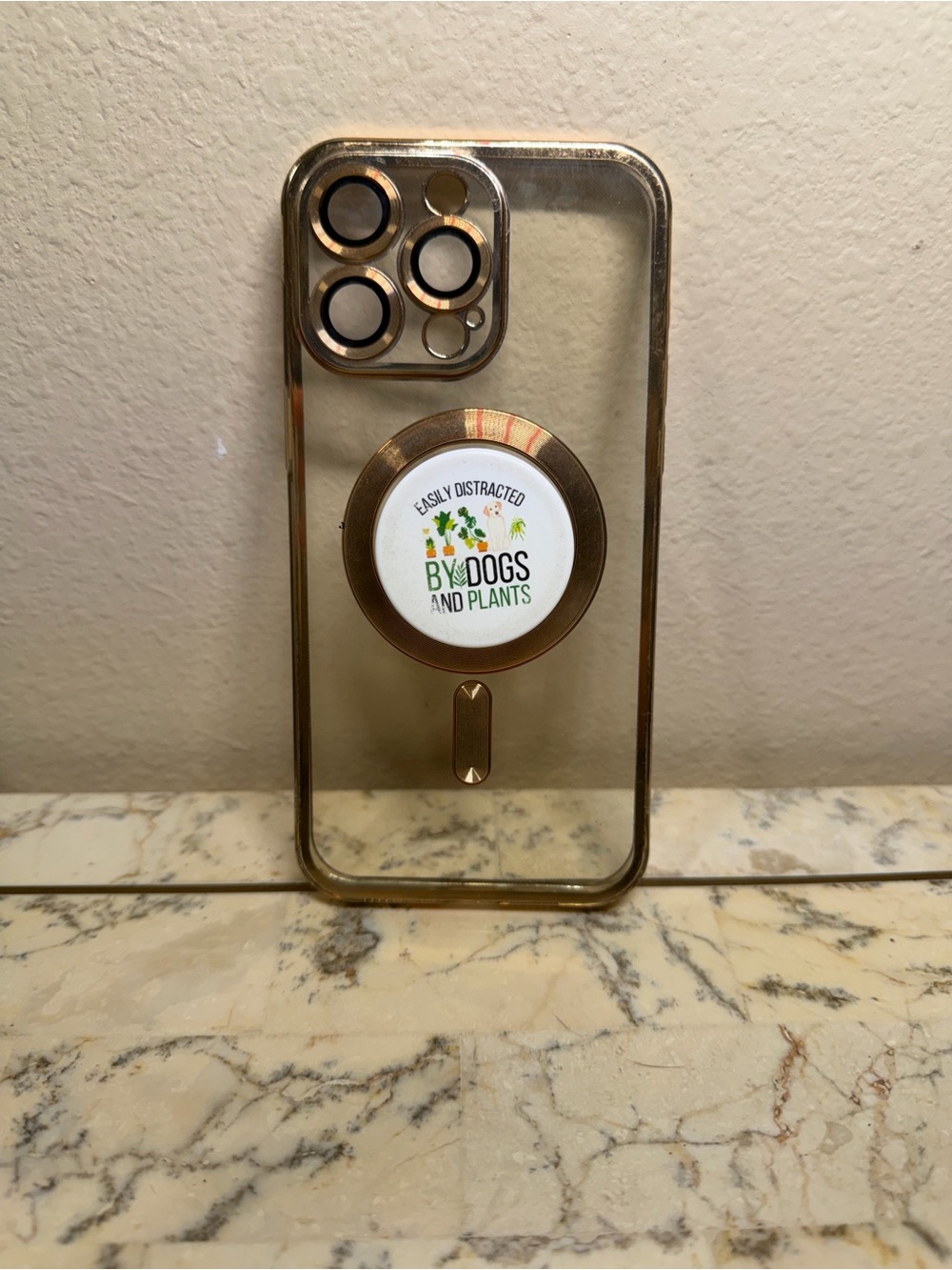 Rose Gold iPhone 15 pro max with PopGrip case